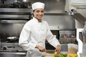 Female chef in restaurant kitchen